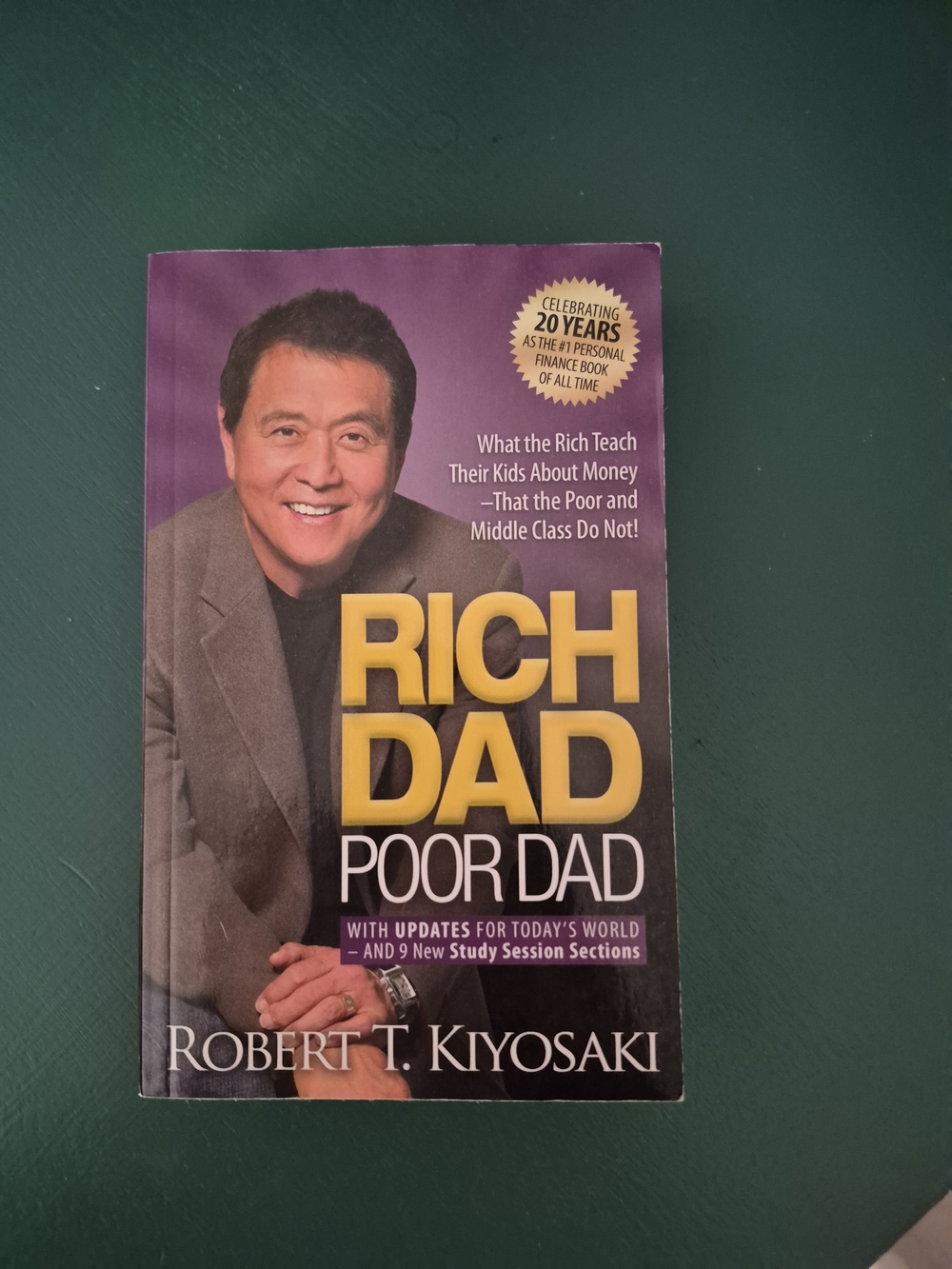 Rich Dad Poor Dad by Robert T. Kiyosaki - Yellow & Purple Cover